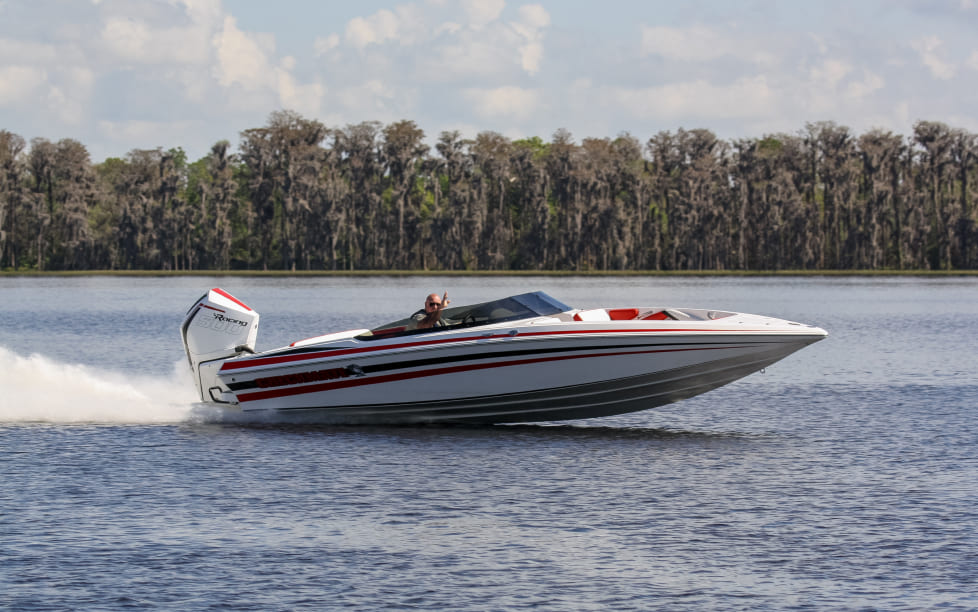 Man driving Checkmate Powerboat 2400 BRX